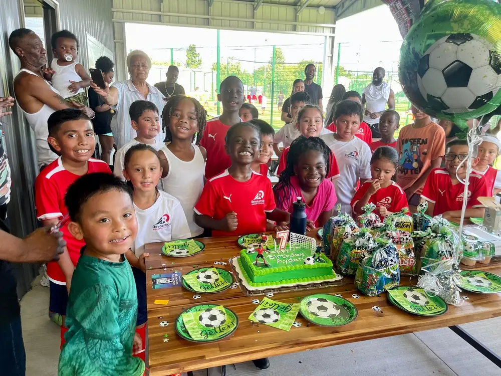Families and kids celebrating at Revolution Soccer Complex